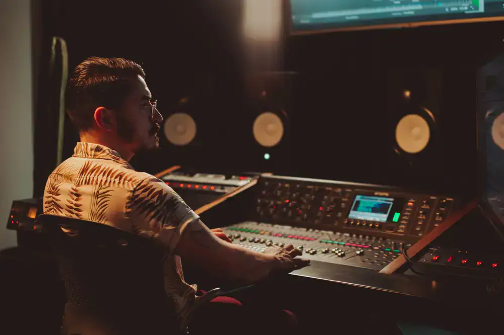 Instructor pointing at a level design on a large monitor